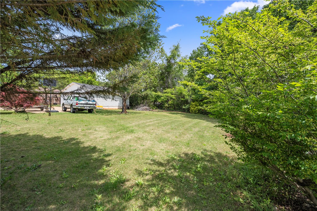 103 Pine Needle Trail Anderson, SC 29625 - Photo 28 of 41 Expansive green yard provides a serene and spacious outdoor environment.