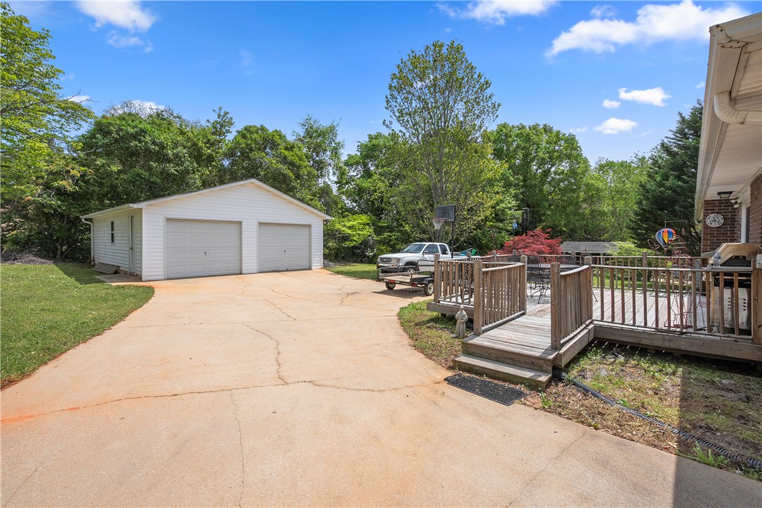 103 Pine Needle Trail Anderson, SC 29625 - Photo 29 of 41 This property features a spacious detached garage and a wooden deck for outdoor enjoyment.