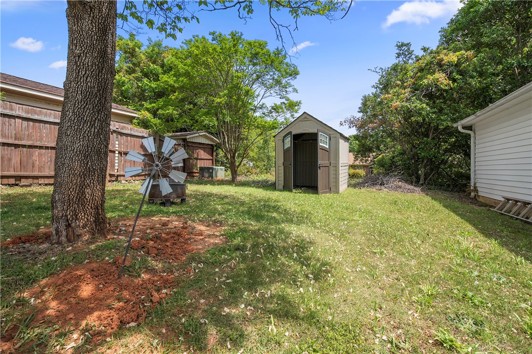 103 Pine Needle Trail Anderson, SC 29625 - Photo 33 of 41 This spacious yard offers a shed for extra storage and mature trees providing natural shade.