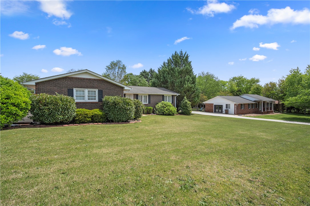 103 Pine Needle Trail Anderson, SC 29625 - Photo 4 of 41 This charming residence offers a peaceful retreat with a spacious yard and classic brick construction.