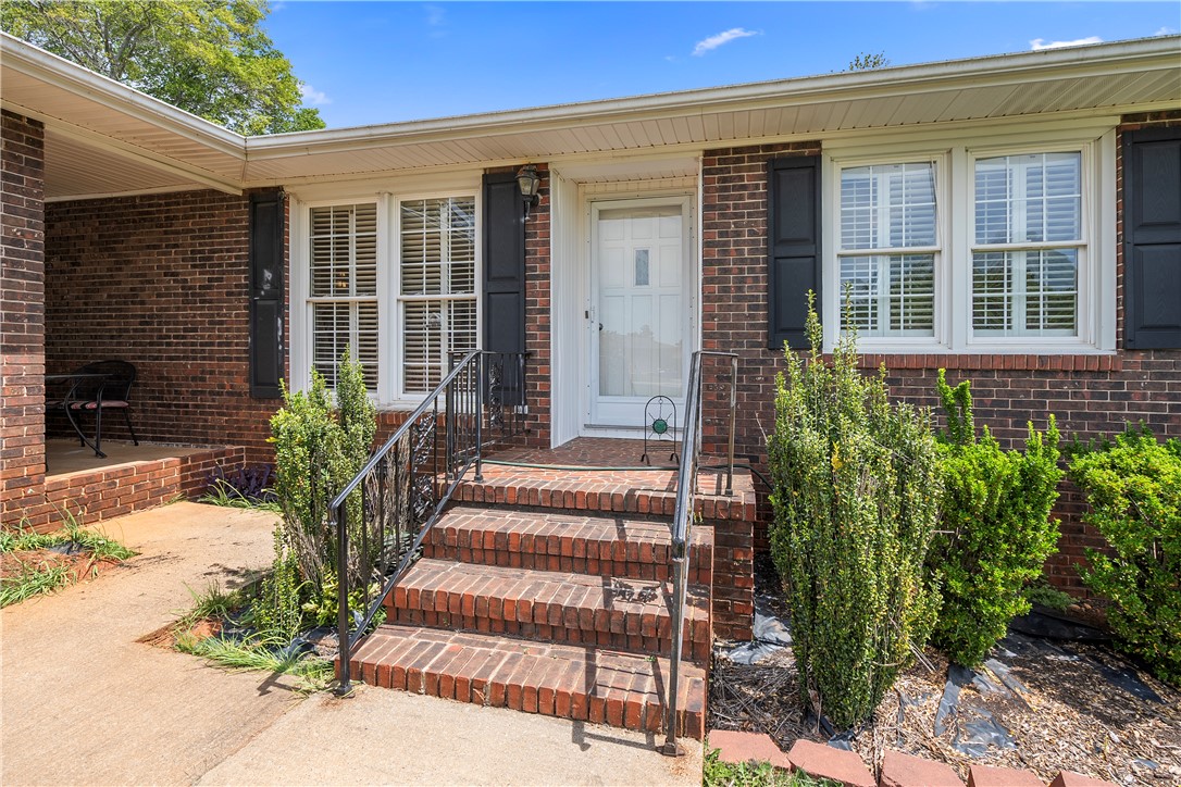 103 Pine Needle Trail Anderson, SC 29625 - Photo 5 of 41 Welcome to a charming brick home with a classic facade and inviting entryway.