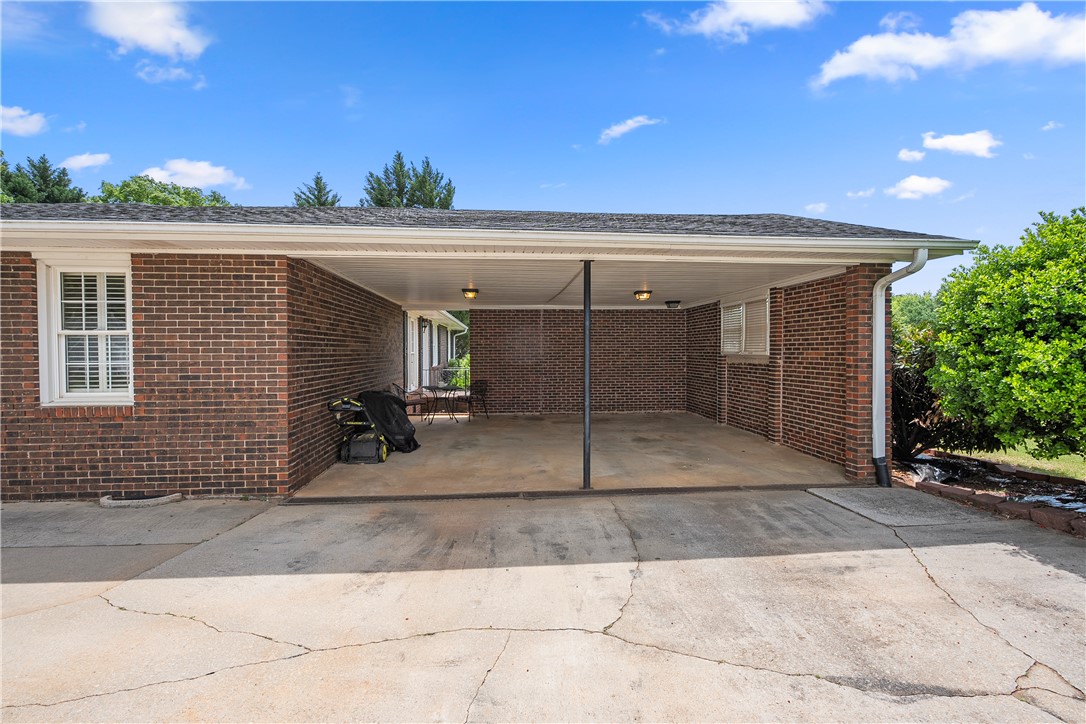 103 Pine Needle Trail Anderson, SC 29625 - Photo 6 of 41 This property features a practical carport providing sheltered parking, ideal for daily convenience.