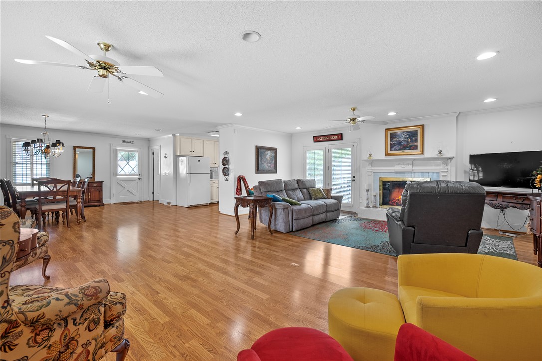 103 Pine Needle Trail Anderson, SC 29625 - Photo 7 of 41 This inviting space features an open layout with gleaming hardwood floors, creating an effortless flow.