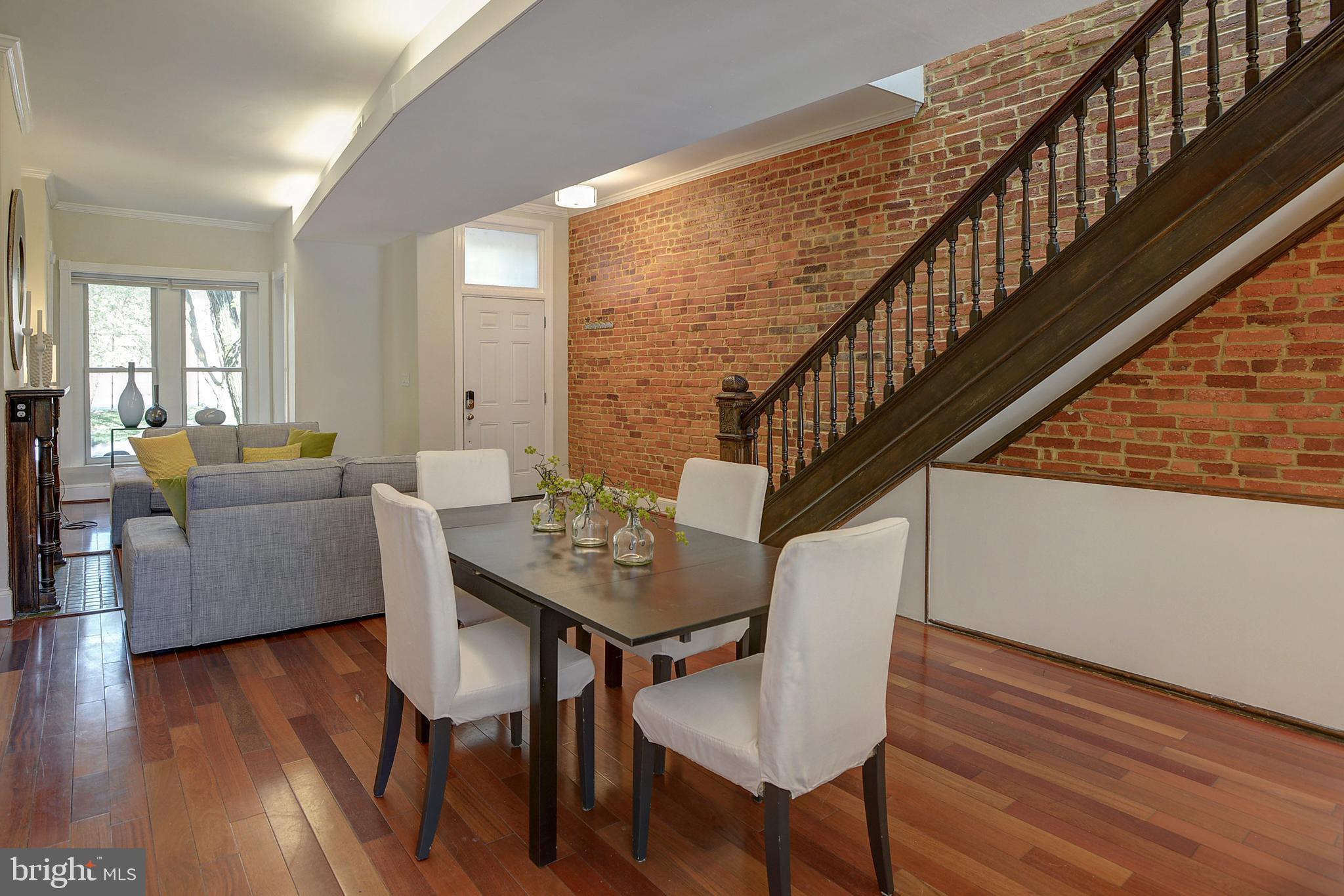 654 9th Street Northeast Washington, DC 20002 - Photo 17 of 33 Open original staircase and exposed brick.