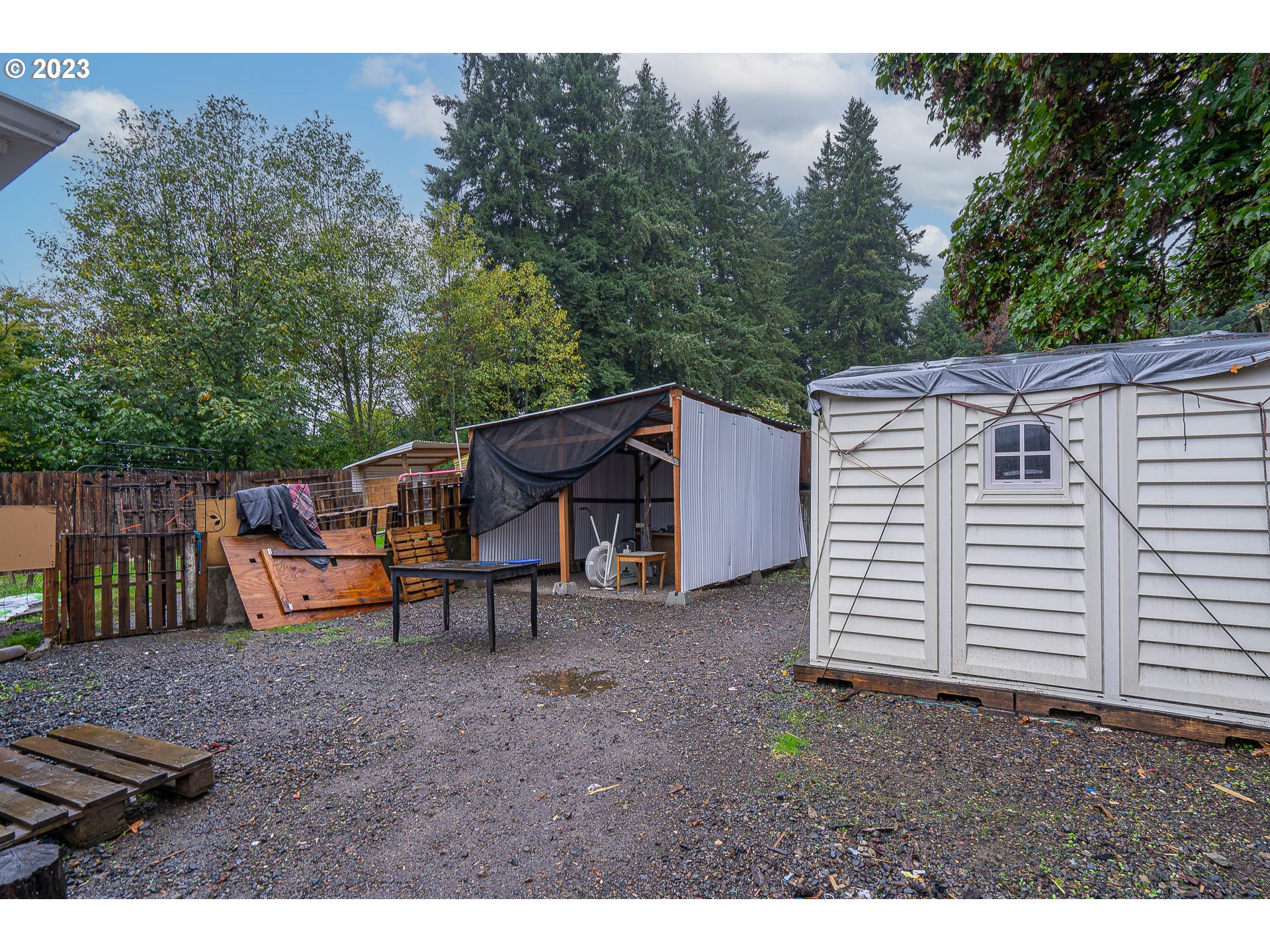 22607 Noti Loop Noti, OR 97461 - Photo 25 of 29 a backyard of a house with barbeque oven and outdoor seating