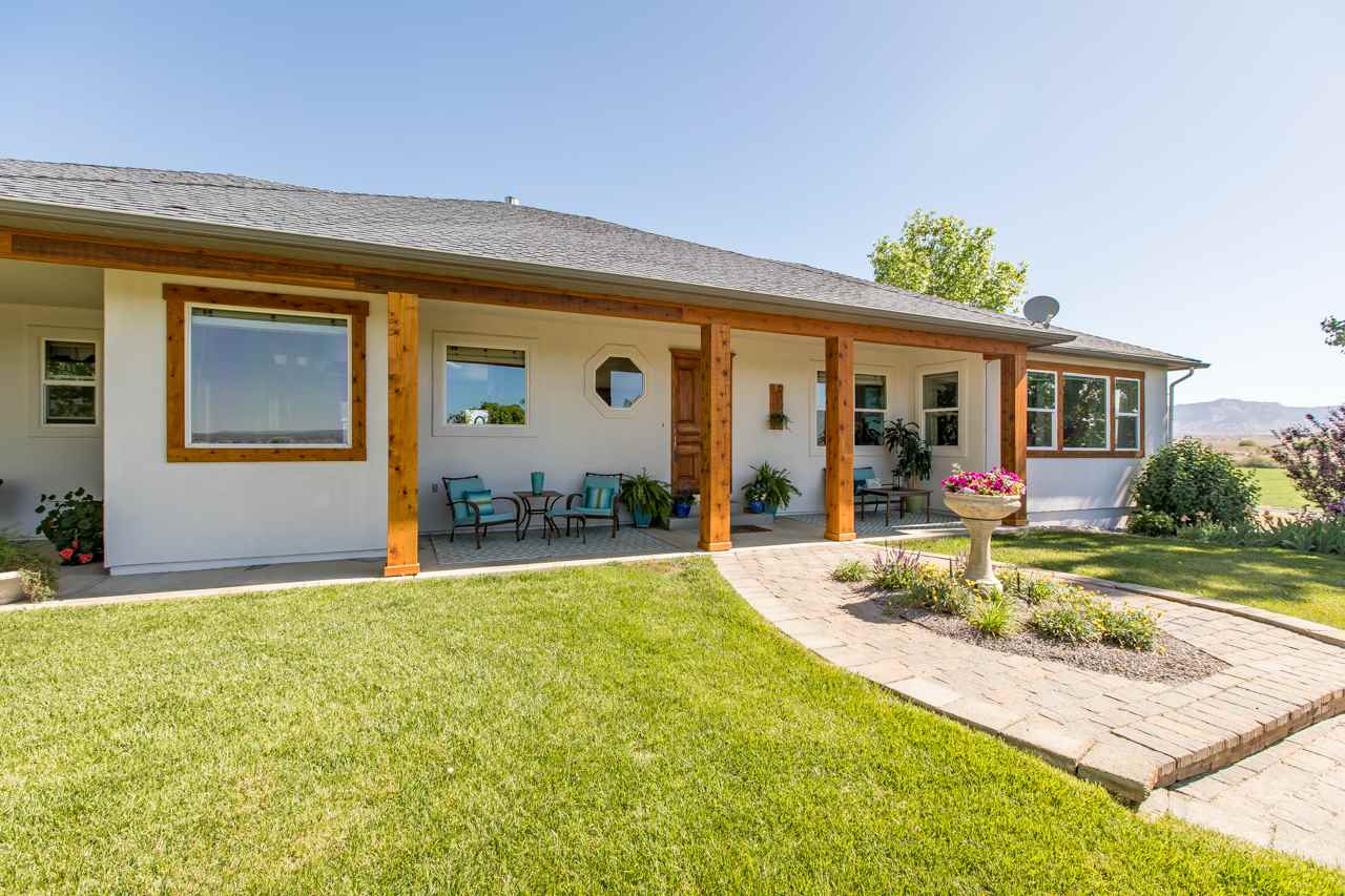 2174 M Road Grand Junction, CO 81505 - Photo 34 of 42 a view of an house with backyard porch and furniture