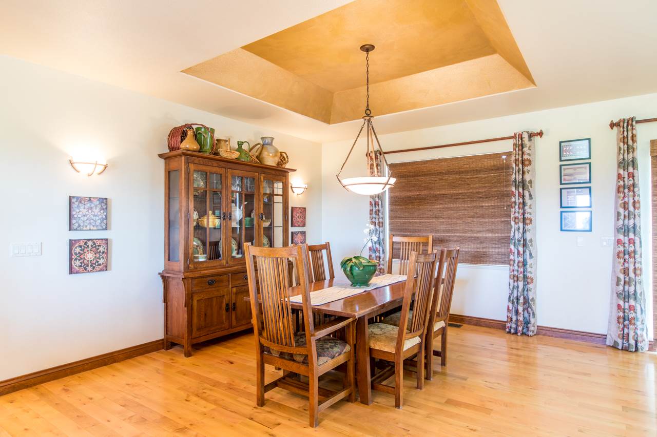 2174 M Road Grand Junction, CO 81505 - Photo 10 of 42 a view of a dining room with furniture window and wooden floor