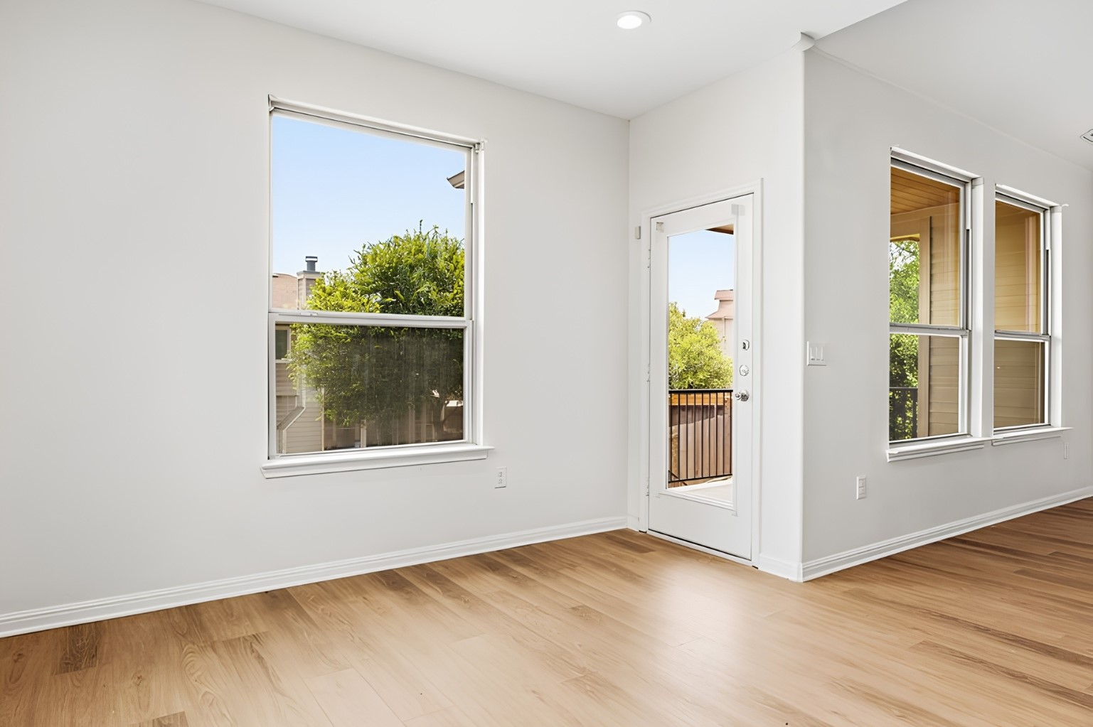 304 Santa Maria Street Georgetown, TX 78628 - Photo 17 of 37 Luminous living space featuring polished hardwood floors and abundant natural light from large windows. Virtually Staged.