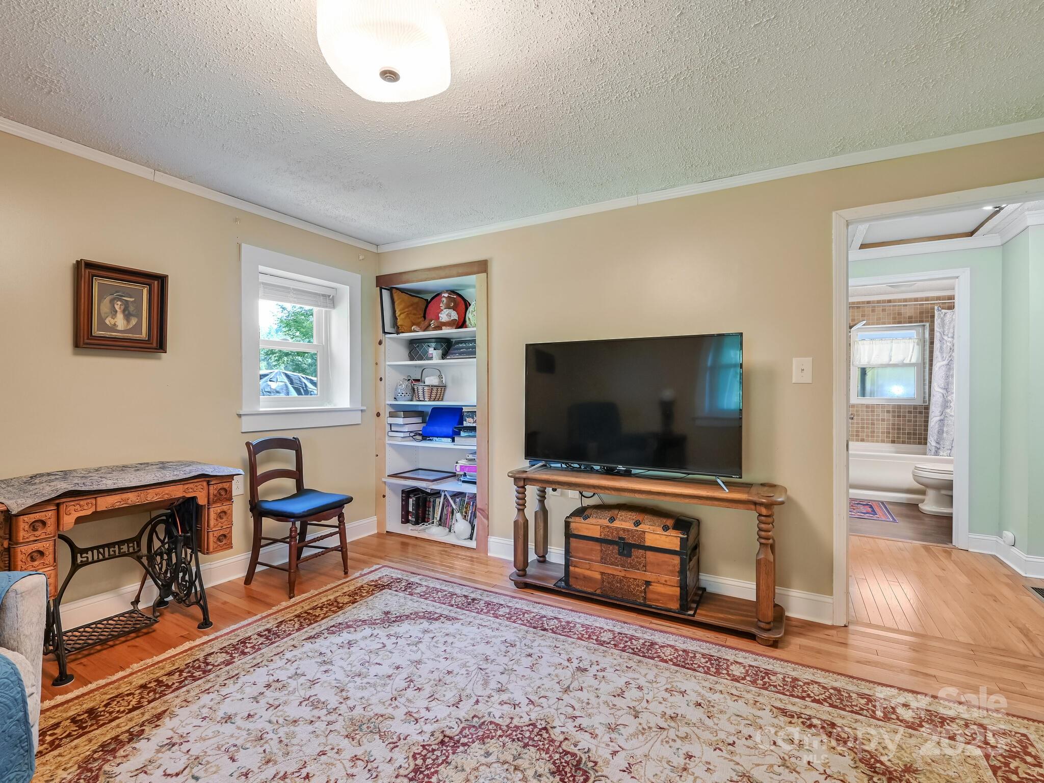 90 Coates Road Marshall, NC 28753 - Photo 12 of 48 a living room with furniture and a flat screen tv
