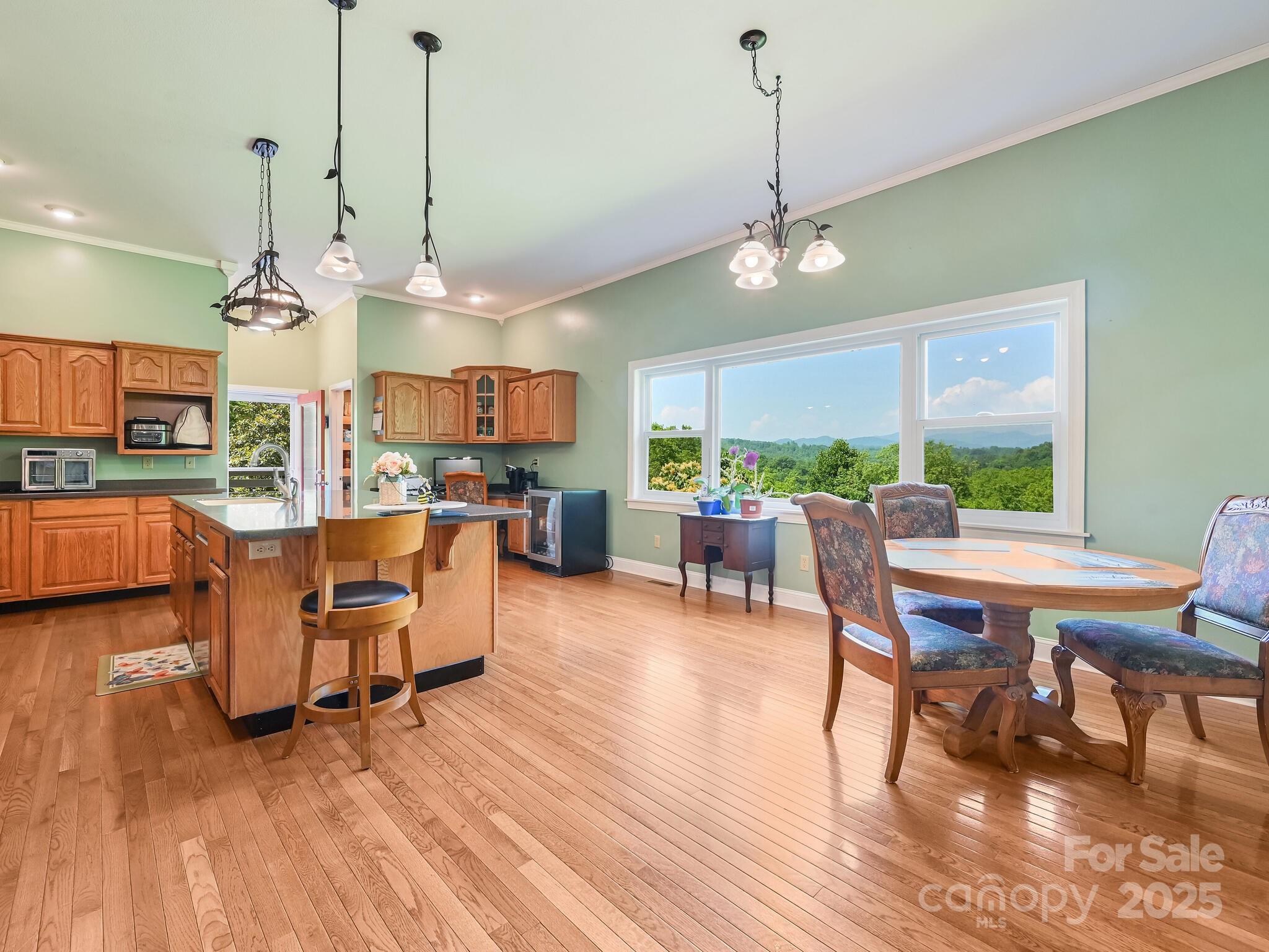 90 Coates Road Marshall, NC 28753 - Photo 17 of 48 a view of a dining room with furniture window and wooden floor