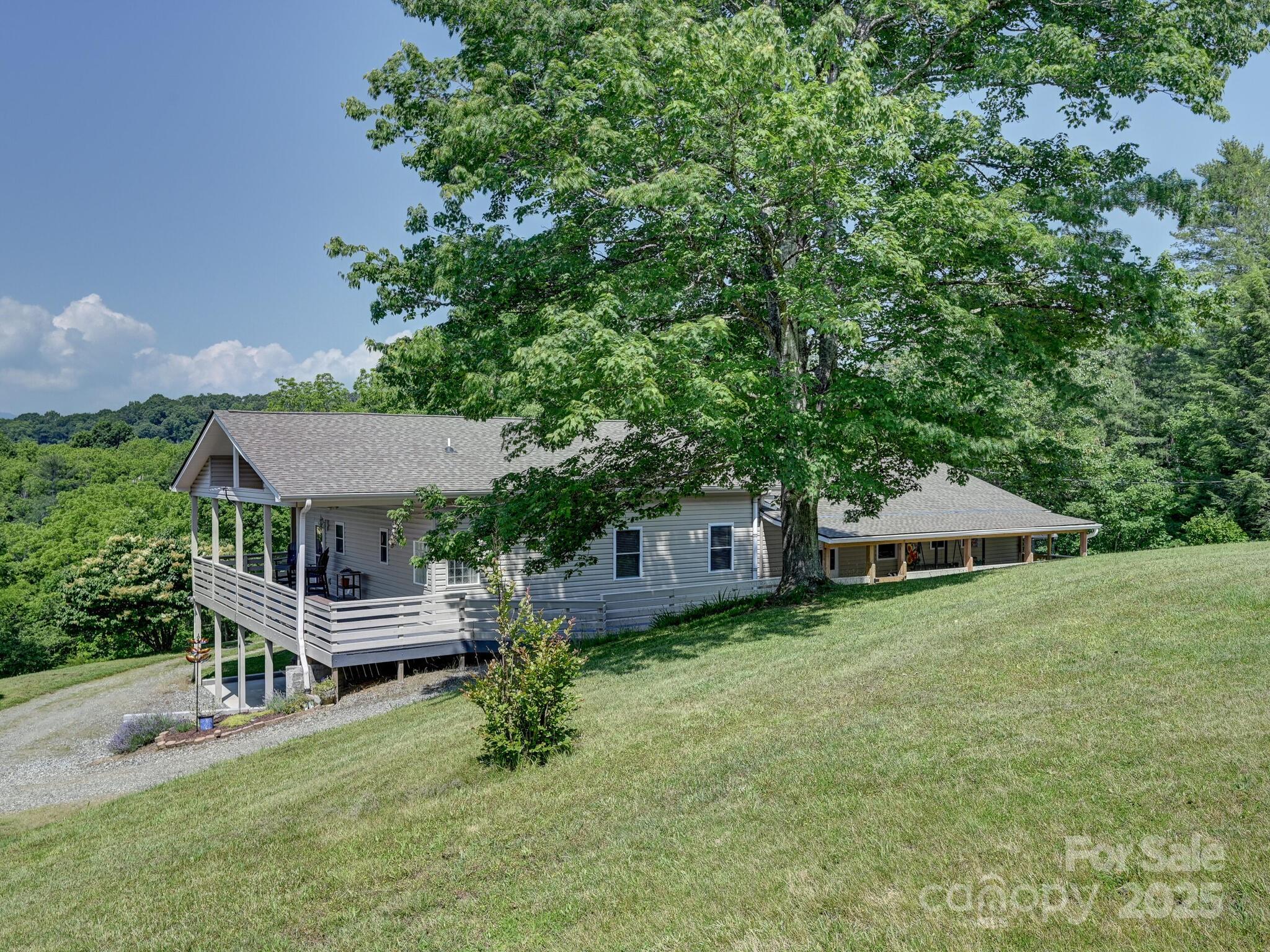 90 Coates Road Marshall, NC 28753 - Photo 2 of 48 an aerial view of a house with a yard table and chairs