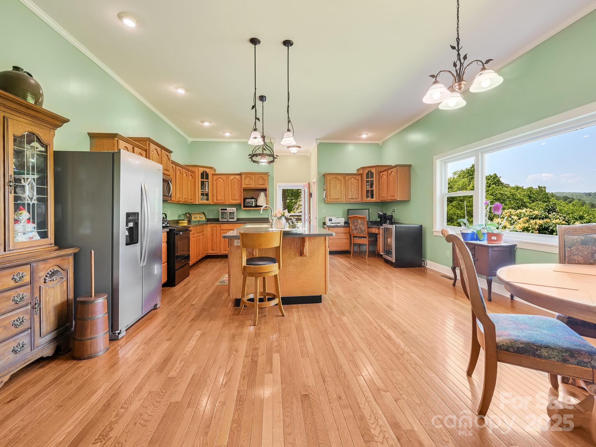 90 Coates Road Marshall, NC 28753 - Photo 21 of 48 a view of a dining room with furniture window and wooden floor