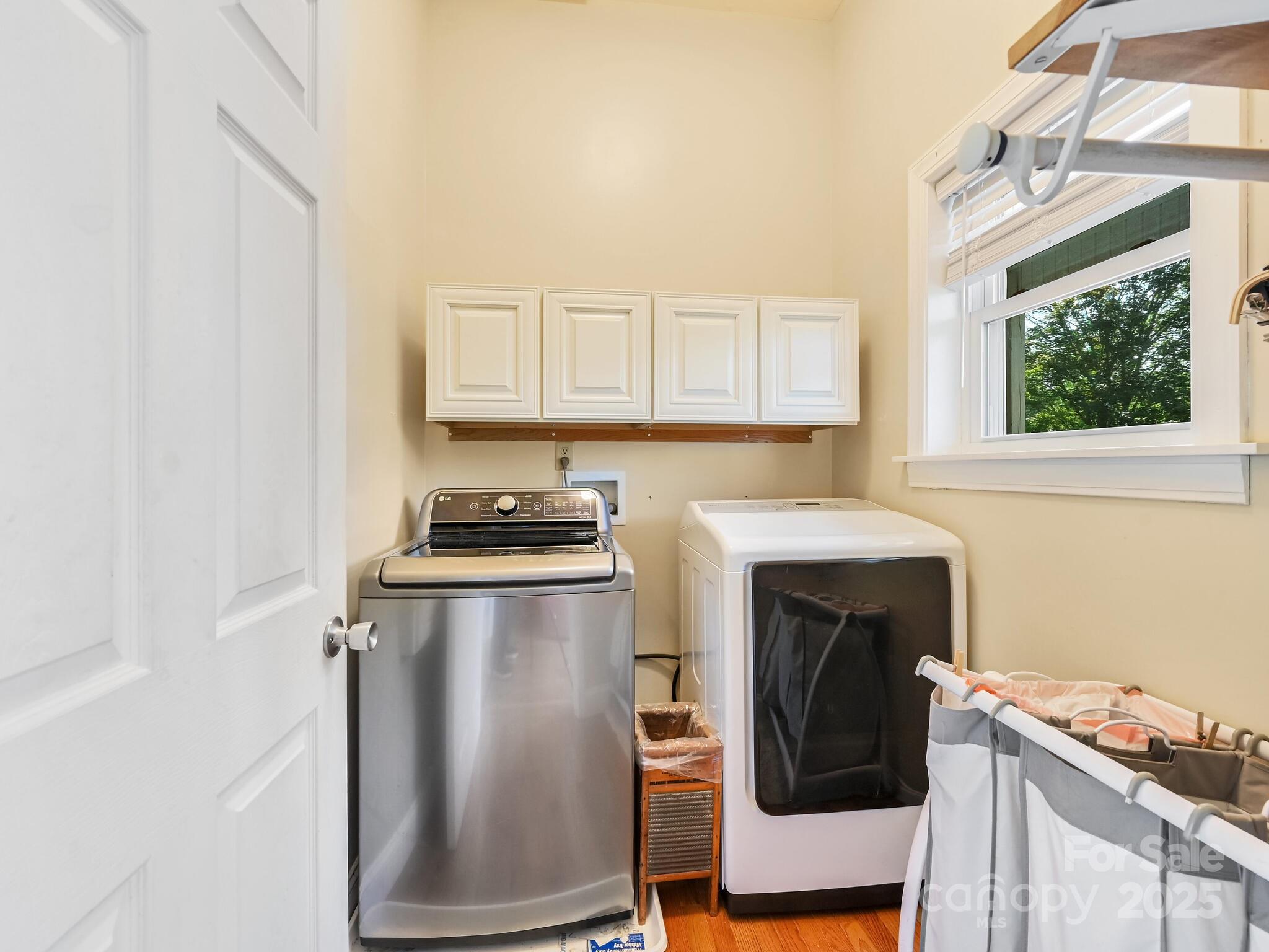 90 Coates Road Marshall, NC 28753 - Photo 26 of 48 a kitchen with stainless steel appliances granite countertop a stove a sink and a microwave