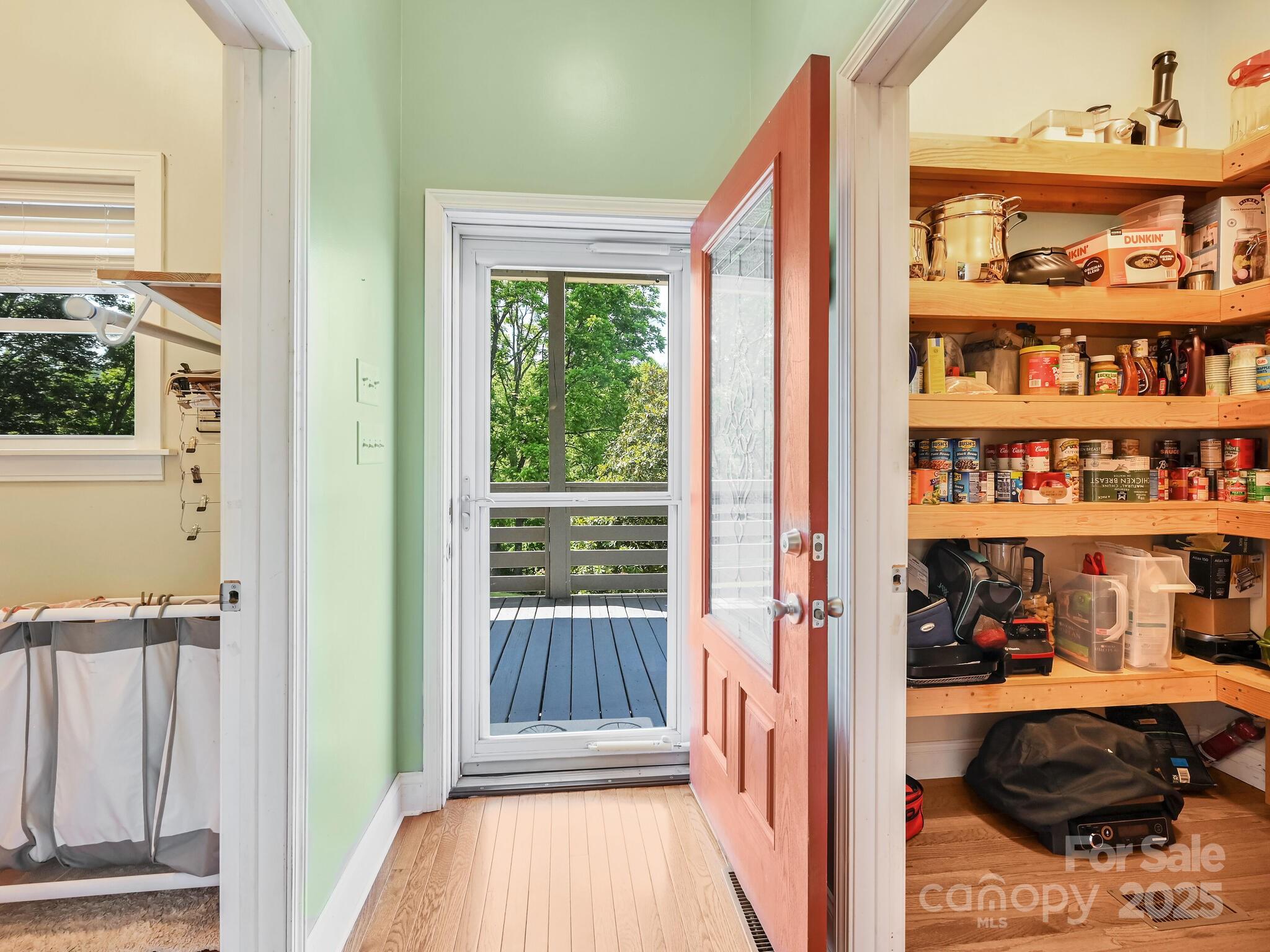 90 Coates Road Marshall, NC 28753 - Photo 27 of 48 a view of walk in closet with clothes and shoes