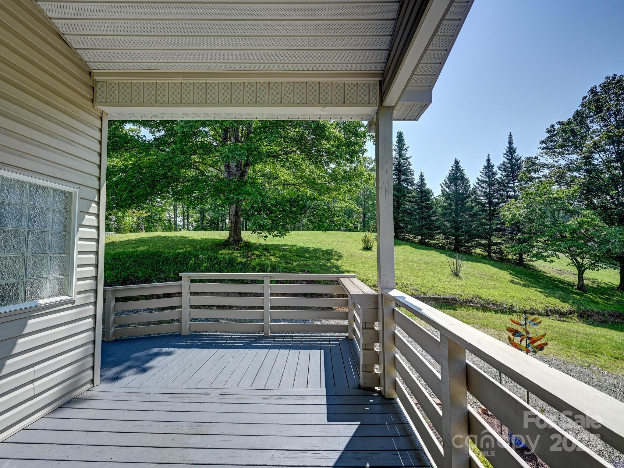 90 Coates Road Marshall, NC 28753 - Photo 29 of 48 a view of a deck with wooden floor and outdoor space
