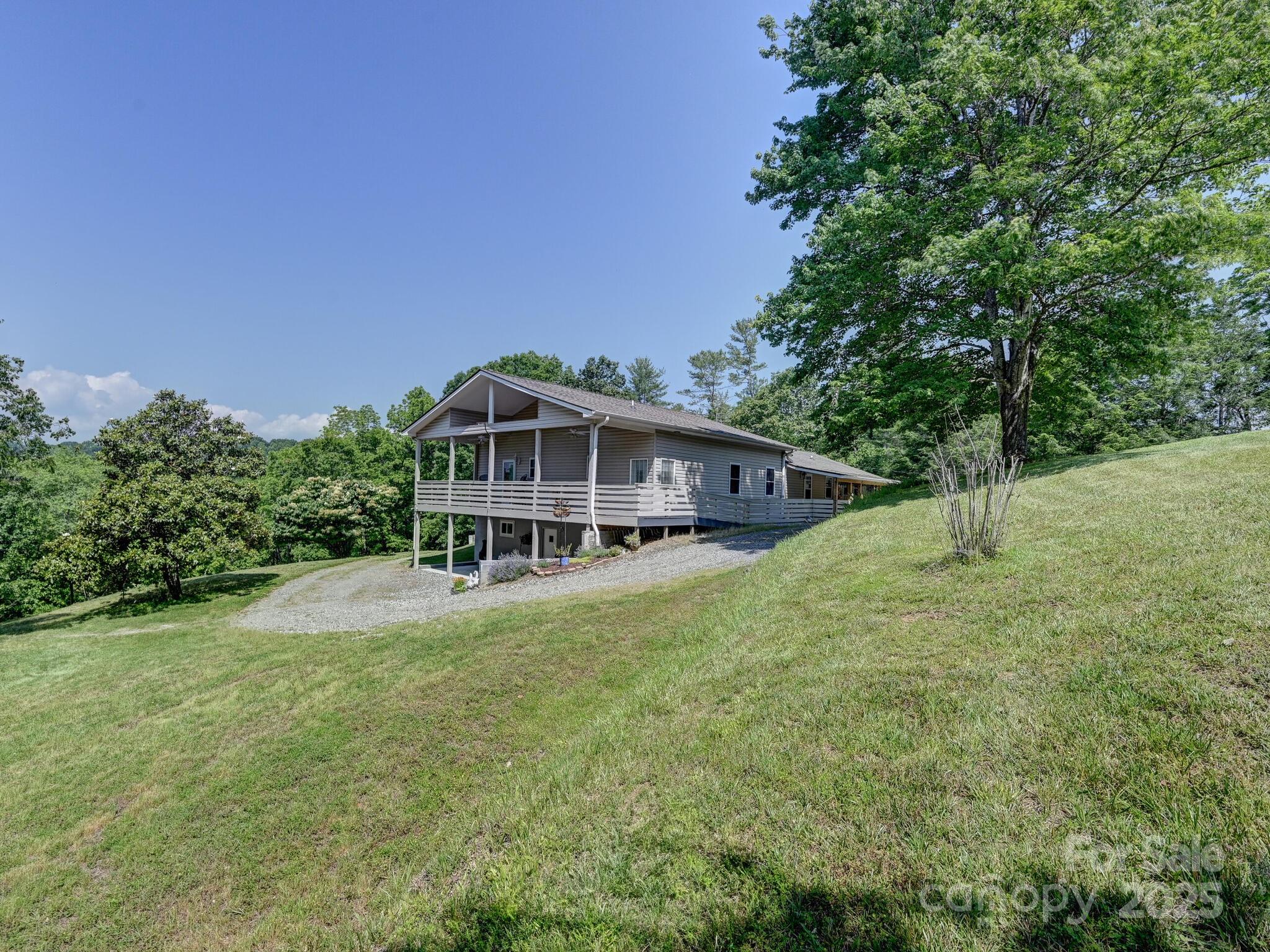 90 Coates Road Marshall, NC 28753 - Photo 3 of 48 a house with trees in the background