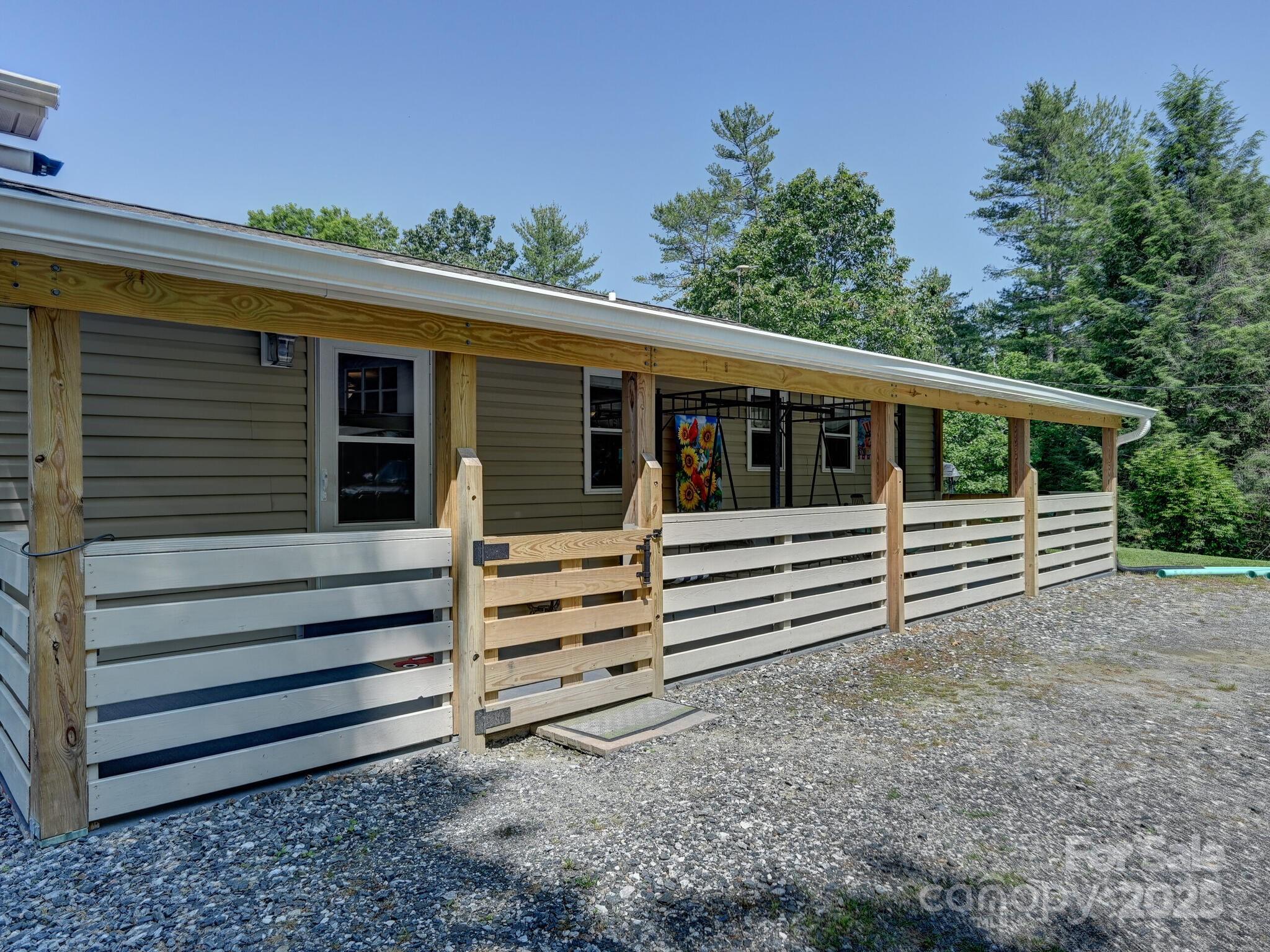 90 Coates Road Marshall, NC 28753 - Photo 34 of 48 a view of a house with a backyard