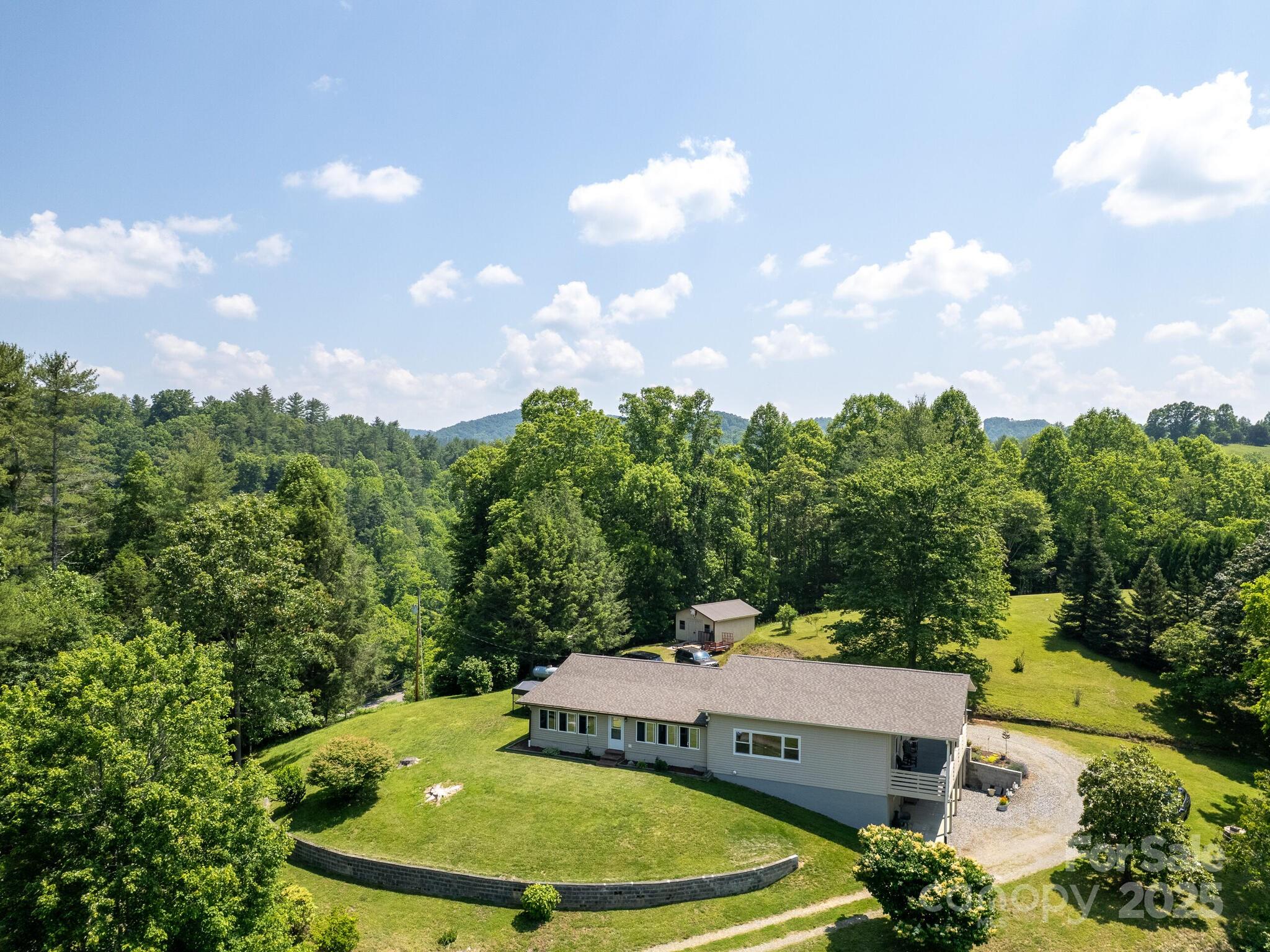 90 Coates Road Marshall, NC 28753 - Photo 45 of 48 a view of a swimming pool with a yard and mountain view