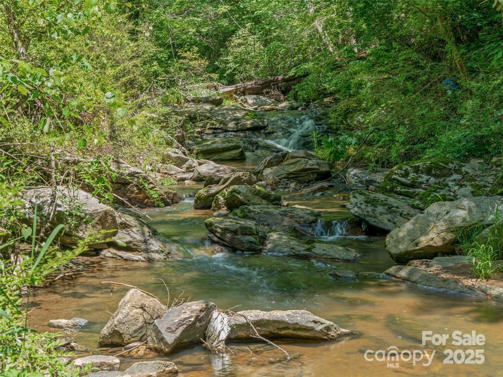90 Coates Road Marshall, NC 28753 - Photo 48 of 48 a view of a lake in the background