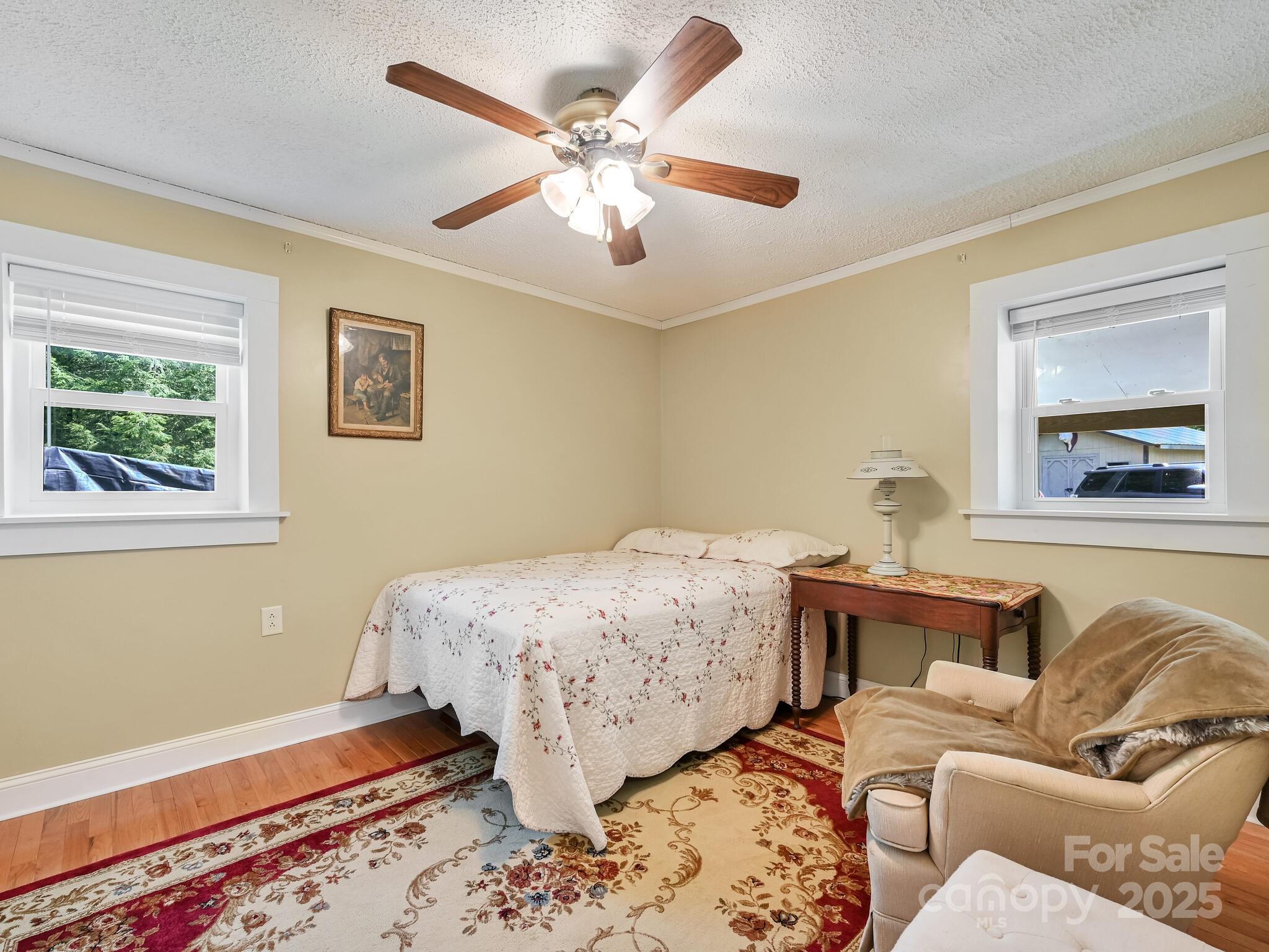 90 Coates Road Marshall, NC 28753 - Photo 9 of 48 a bed room with a bed and a couch