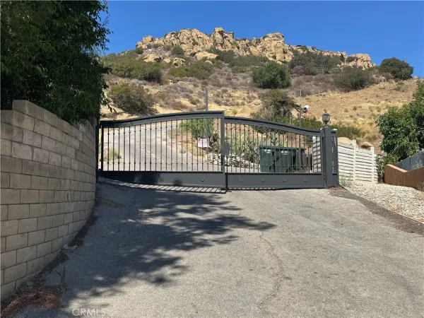 a view of a fence in front of a house