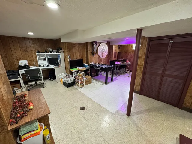 a view of a livingroom with furniture and a flat screen tv