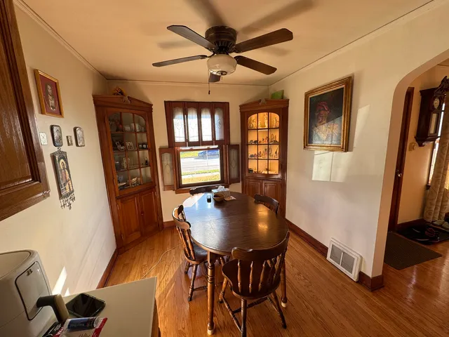 a workspace with furniture window and wooden floor