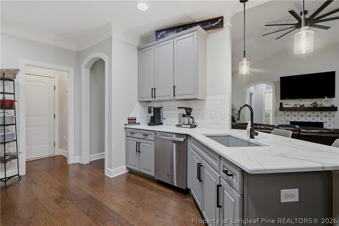 148 Heatherspring Way Spring Lake, NC 28390 - Photo 20 of 50 a kitchen with white cabinets and sink
