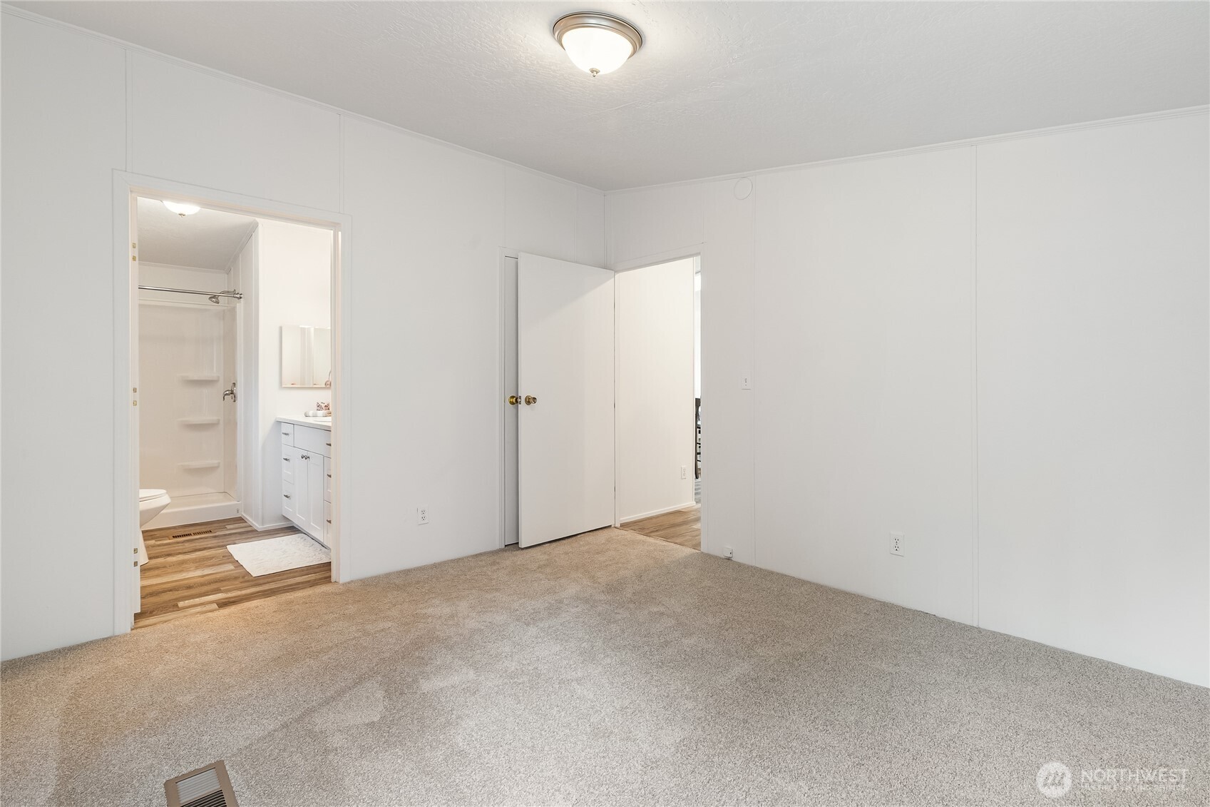 2350 Douglas Road, Unit 39 Ferndale, WA 98248 - Photo 19 of 35 an empty room with white cabinet and mirrors