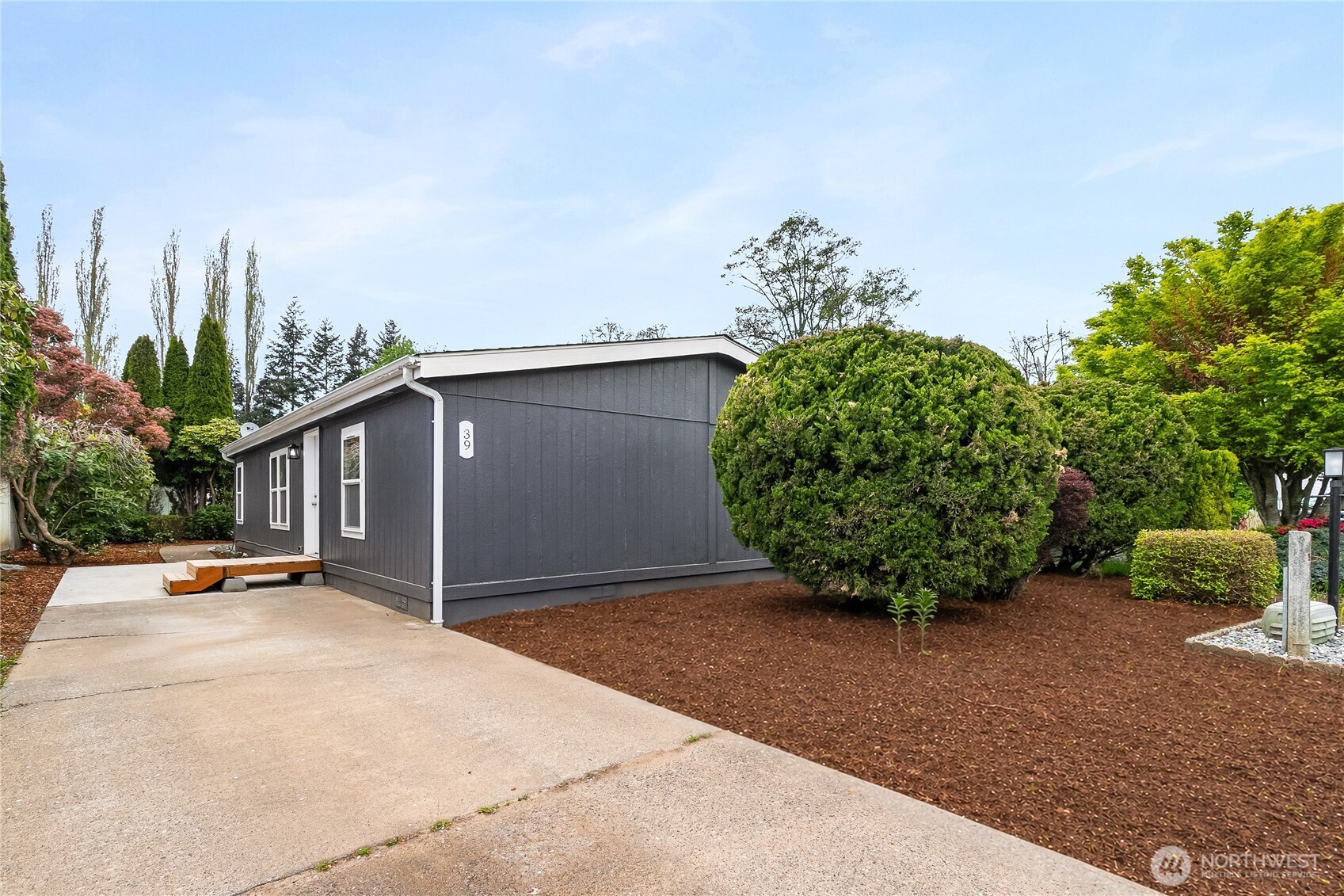 2350 Douglas Road, Unit 39 Ferndale, WA 98248 - Photo 2 of 35 a view of a backyard with potted plants