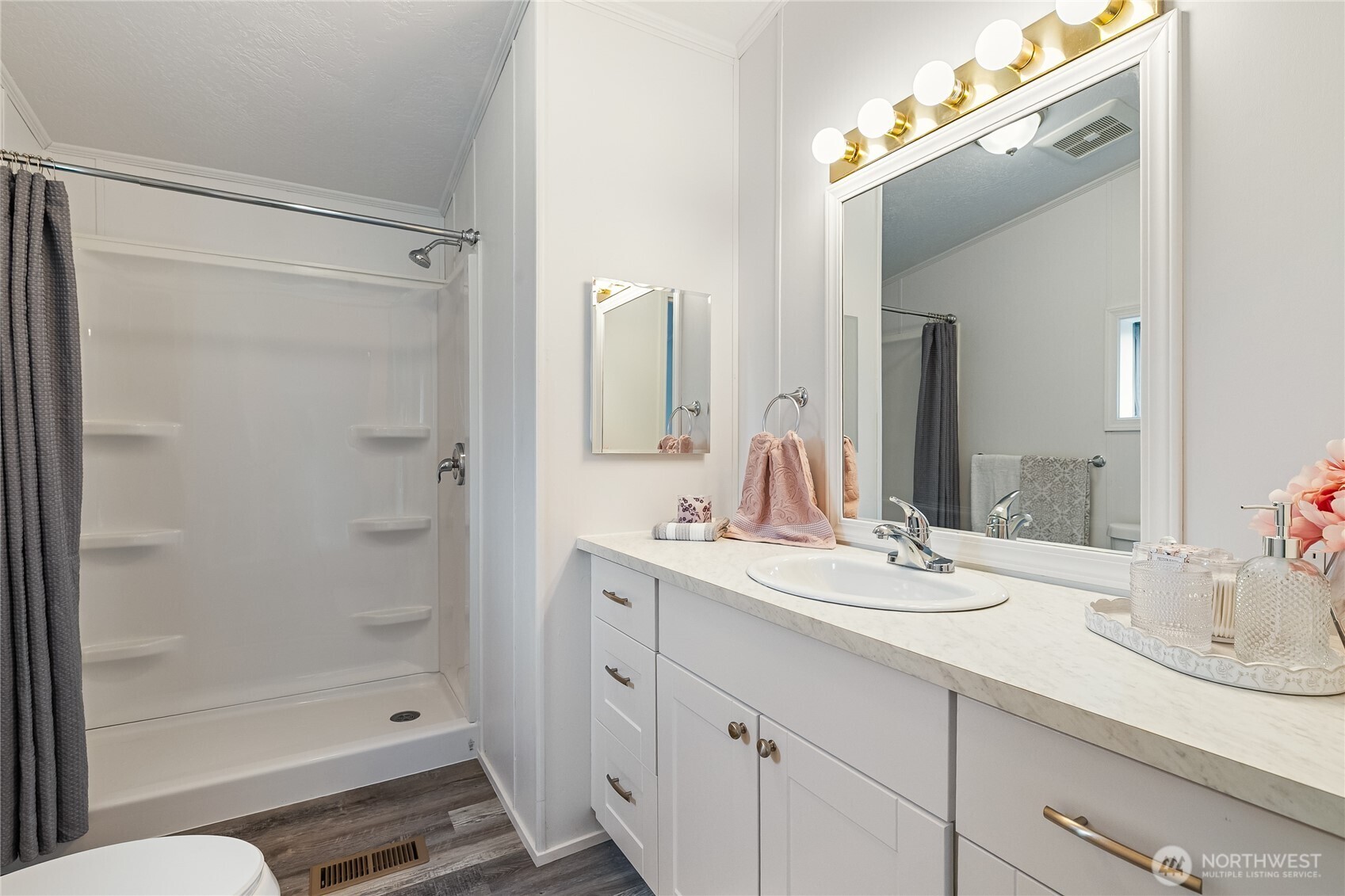 2350 Douglas Road, Unit 39 Ferndale, WA 98248 - Photo 21 of 35 a bathroom with a shower sink and mirror