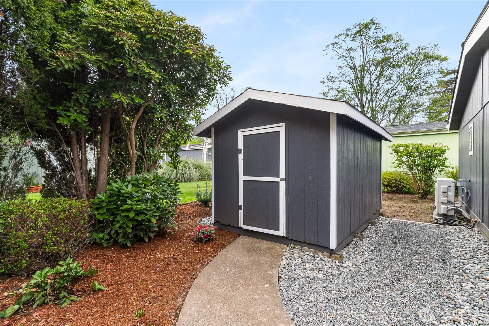 2350 Douglas Road, Unit 39 Ferndale, WA 98248 - Photo 27 of 35 a front view of a house with garden