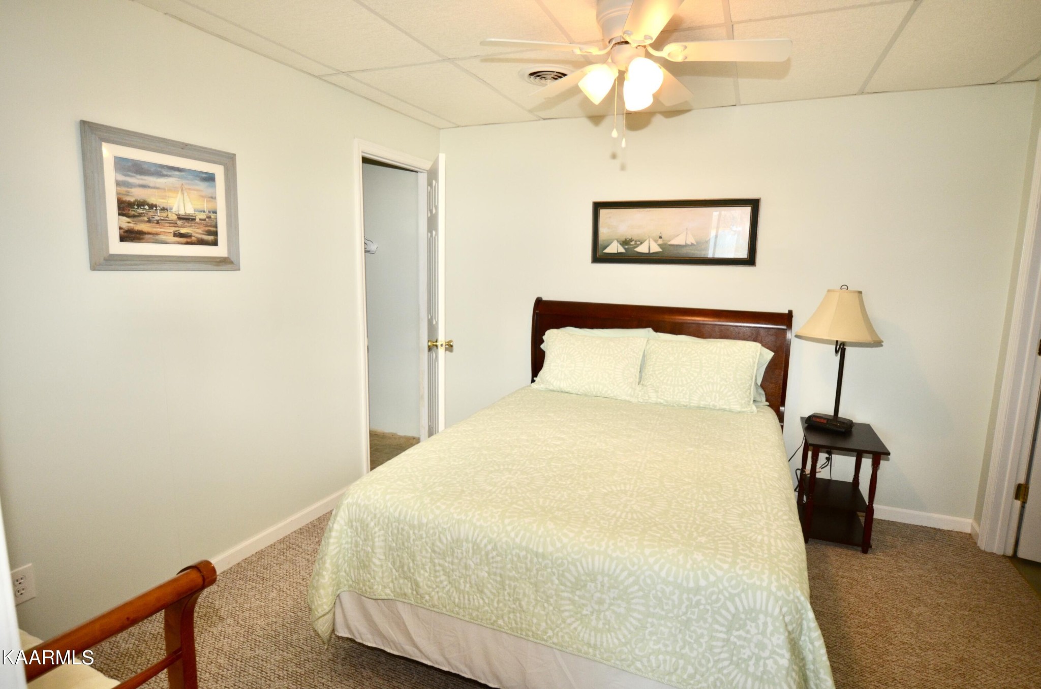 415 Sam Heim Road Rutledge, TN 37861 - Photo 30 of 41 a bedroom with a bed and a painting on the wall