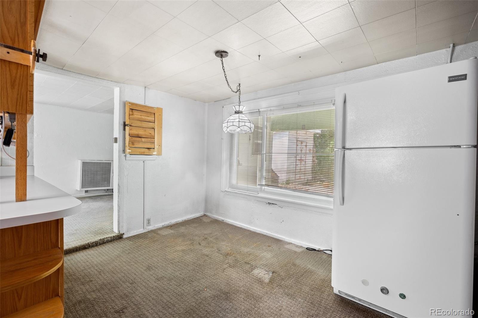 315 Spring Street Morrison, CO 80465 - Photo 16 of 40 a view of an empty room with a window