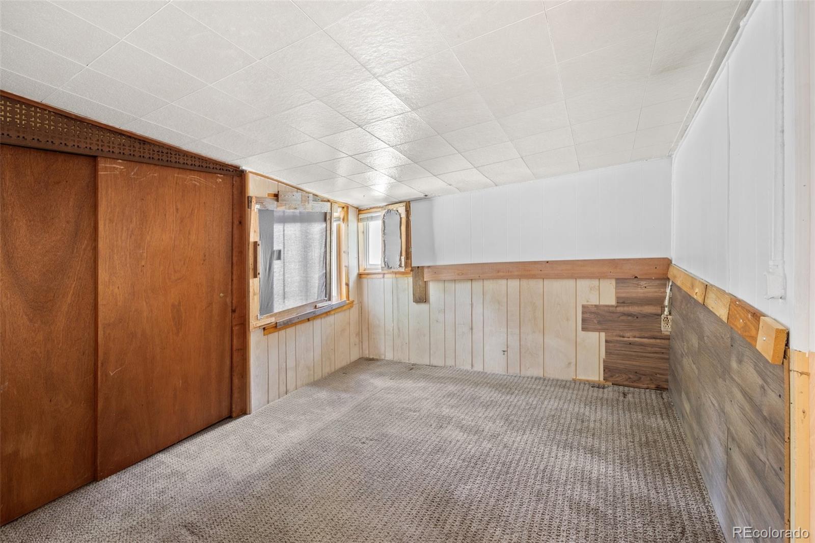 315 Spring Street Morrison, CO 80465 - Photo 19 of 40 a view of an empty room with a window