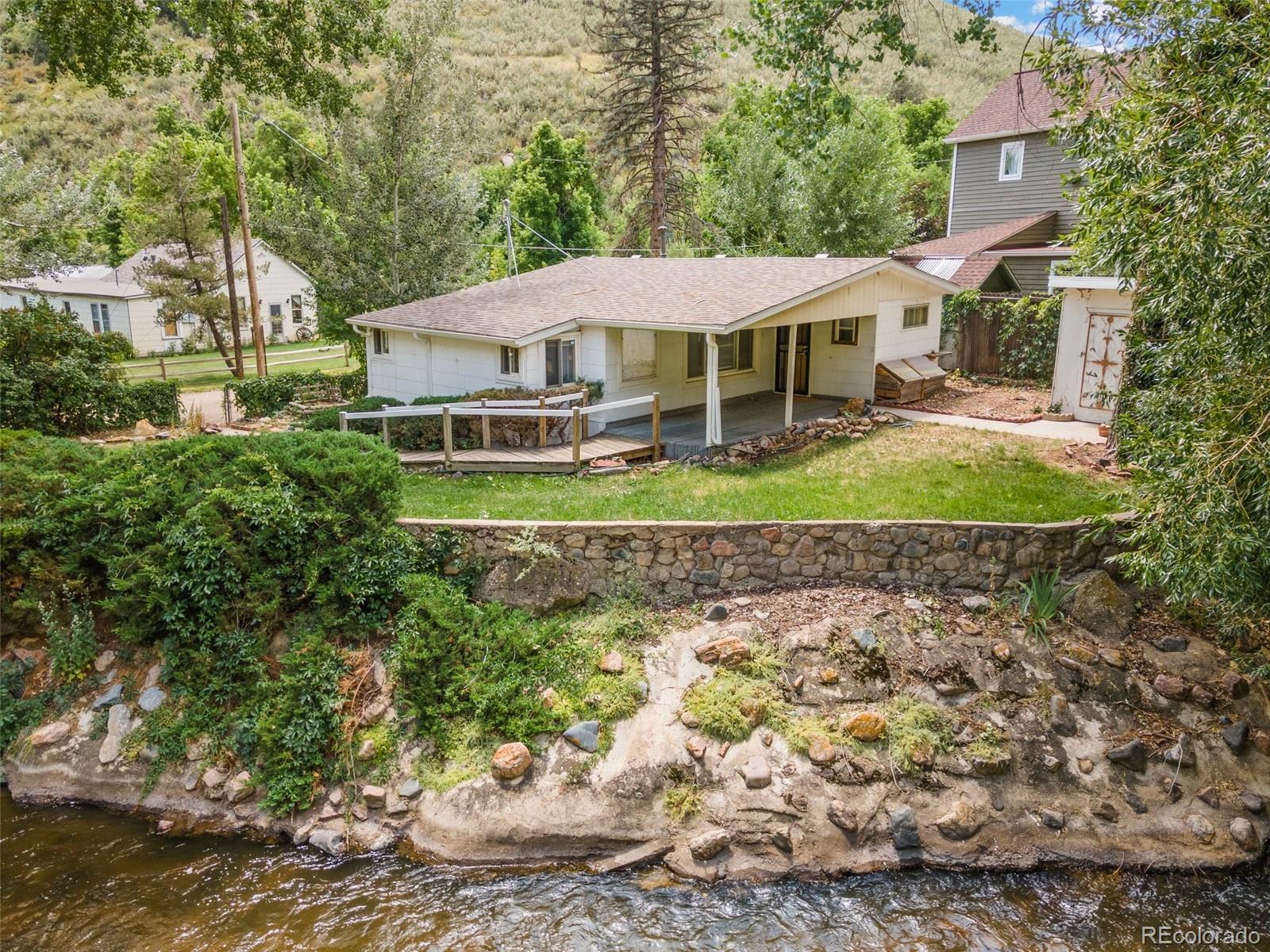 315 Spring Street Morrison, CO 80465 - Photo 2 of 40 a front view of a house with a yard