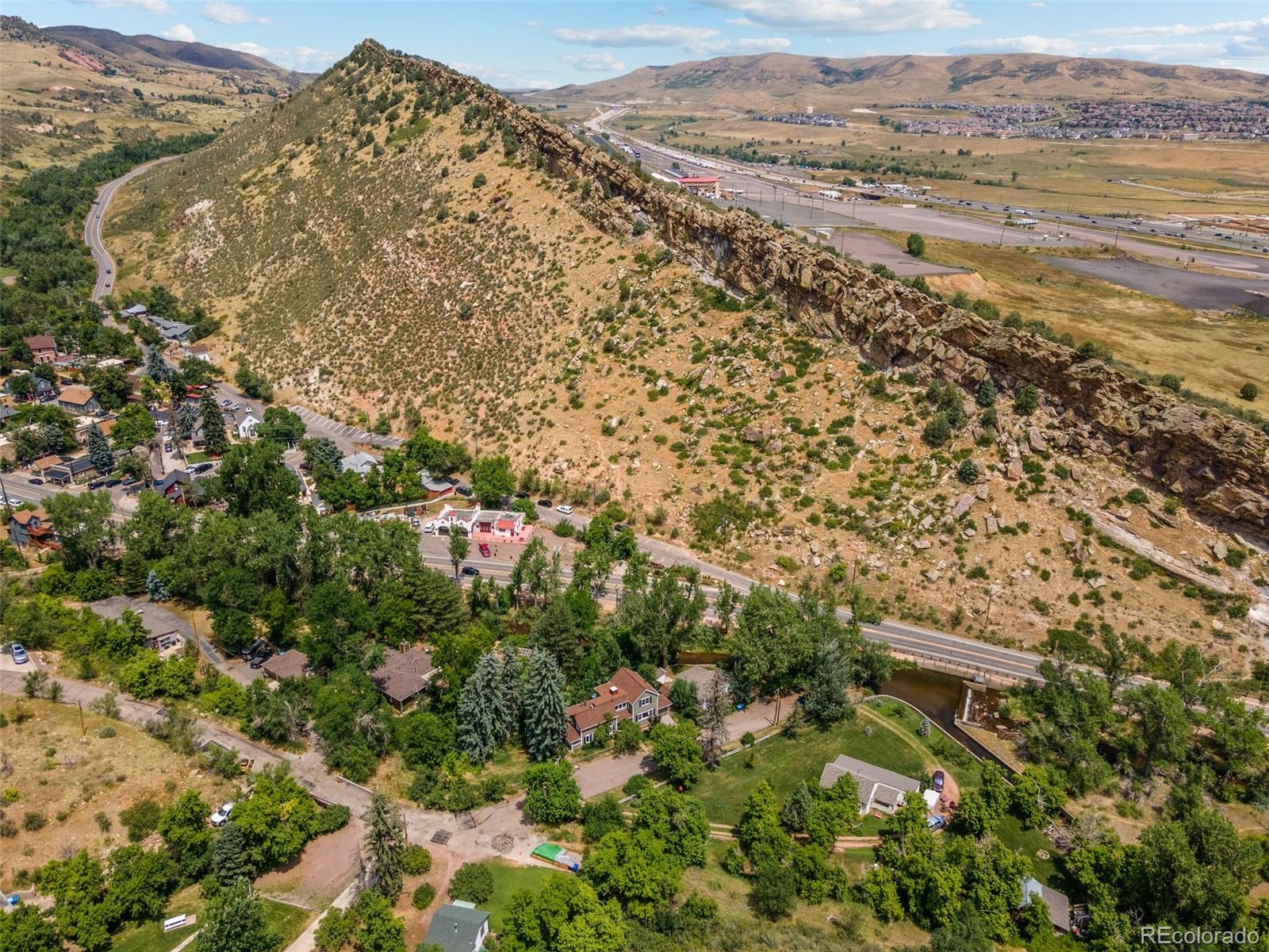 315 Spring Street Morrison, CO 80465 - Photo 22 of 40 a view of a field with mountains in the background