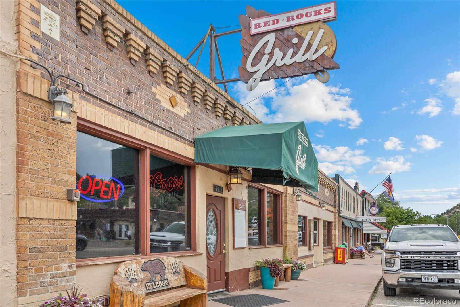 315 Spring Street Morrison, CO 80465 - Photo 26 of 40 a view of a street with retail shops