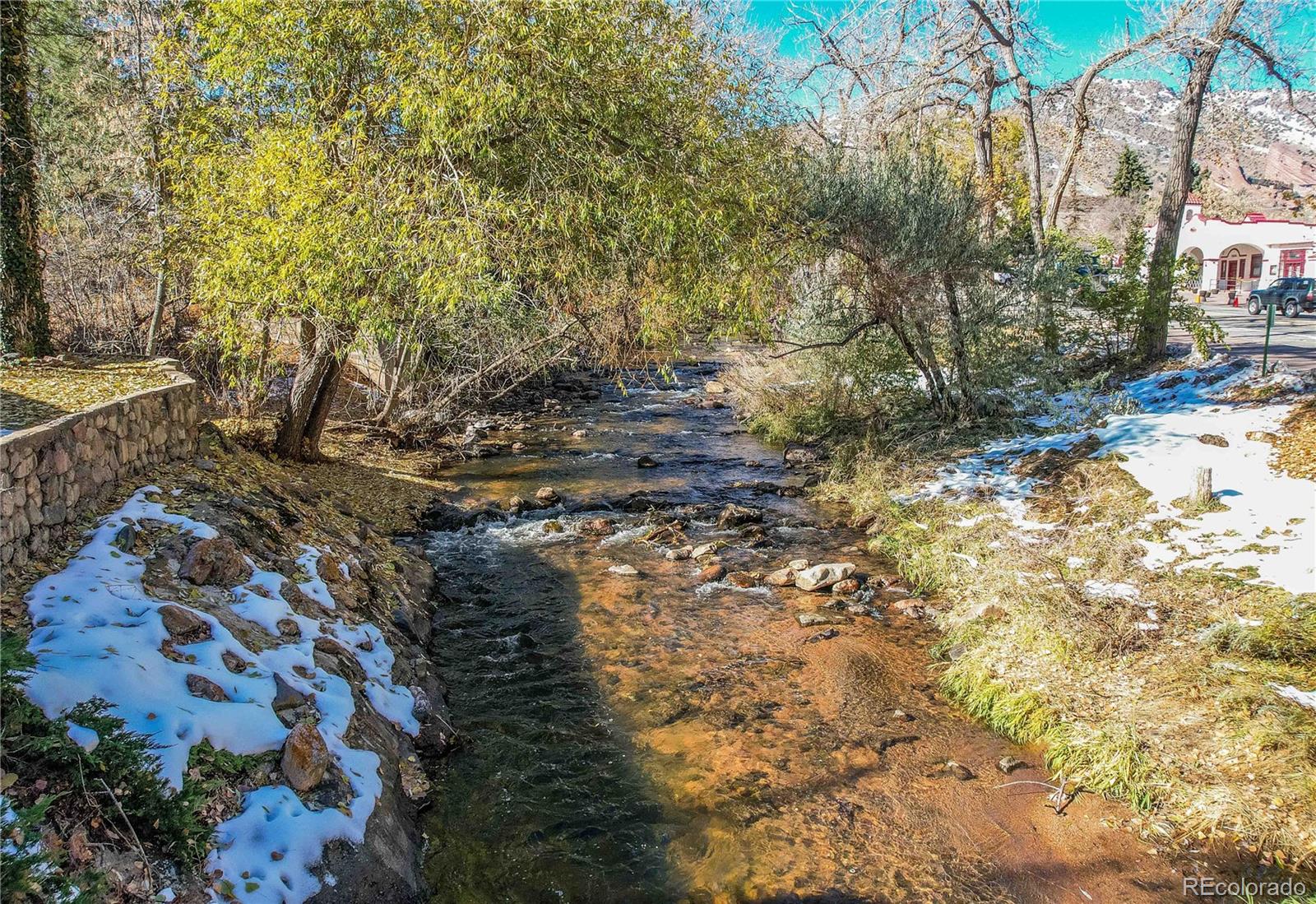 315 Spring Street Morrison, CO 80465 - Photo 4 of 40 a view of a yard with plants and trees