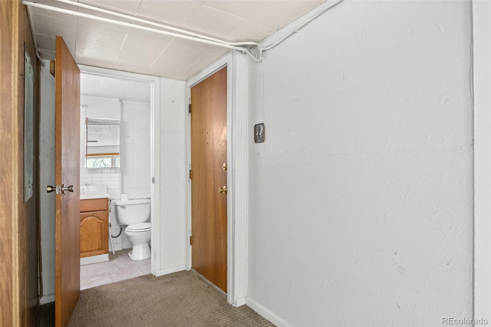 315 Spring Street Morrison, CO 80465 - Photo 10 of 40 a bathroom with a shower and a toilet