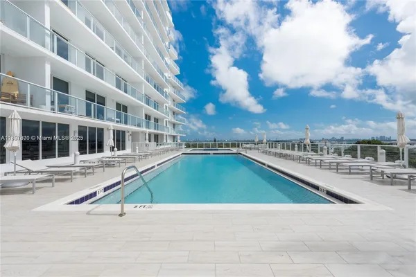 a view of a swimming pool with a patio