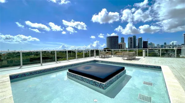 a view of a swimming pool with a patio