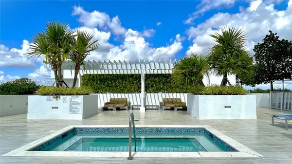 a view of a patio with a table and chairs