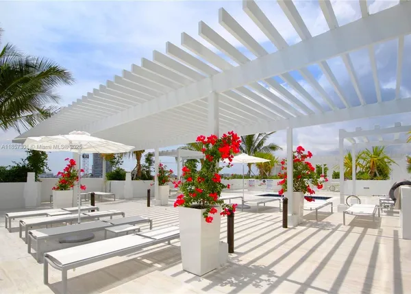 a view of a terrace with furniture