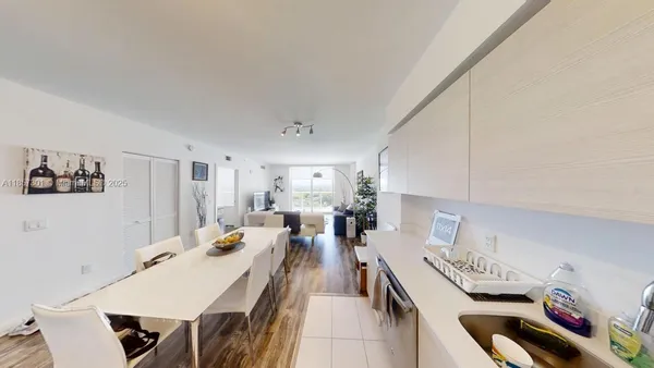 a very nice looking dining room with a table and chairs