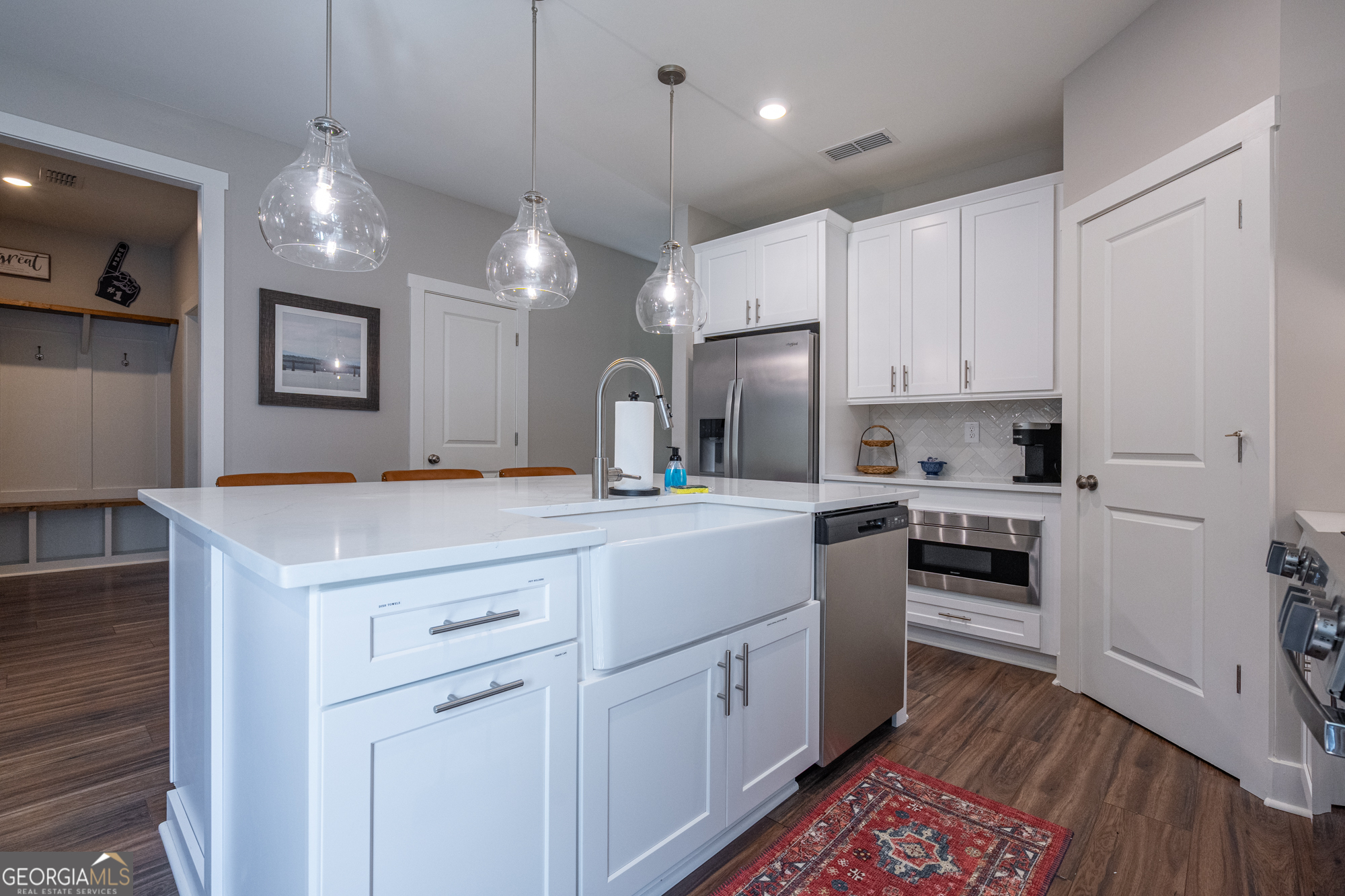 143 Old Alabama Road Southeast Emerson, GA 30137 - Photo 10 of 48 a kitchen with a white wooden cabinets and white appliances