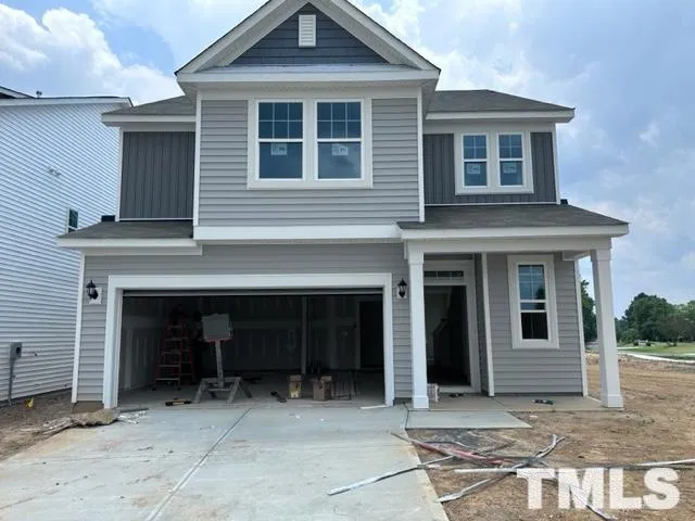 a front view of a house with yard