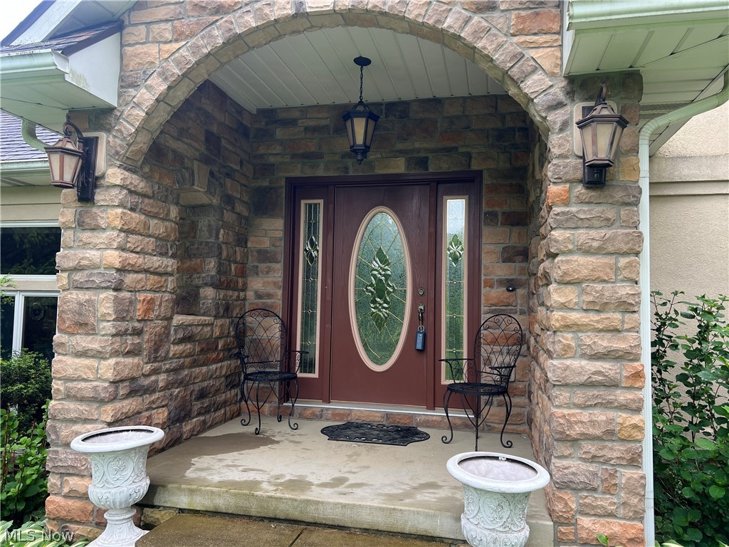1534 West Comet Road Clinton, OH 44216 - Photo 4 of 43 Stone porch entranceway to a very stunning home.