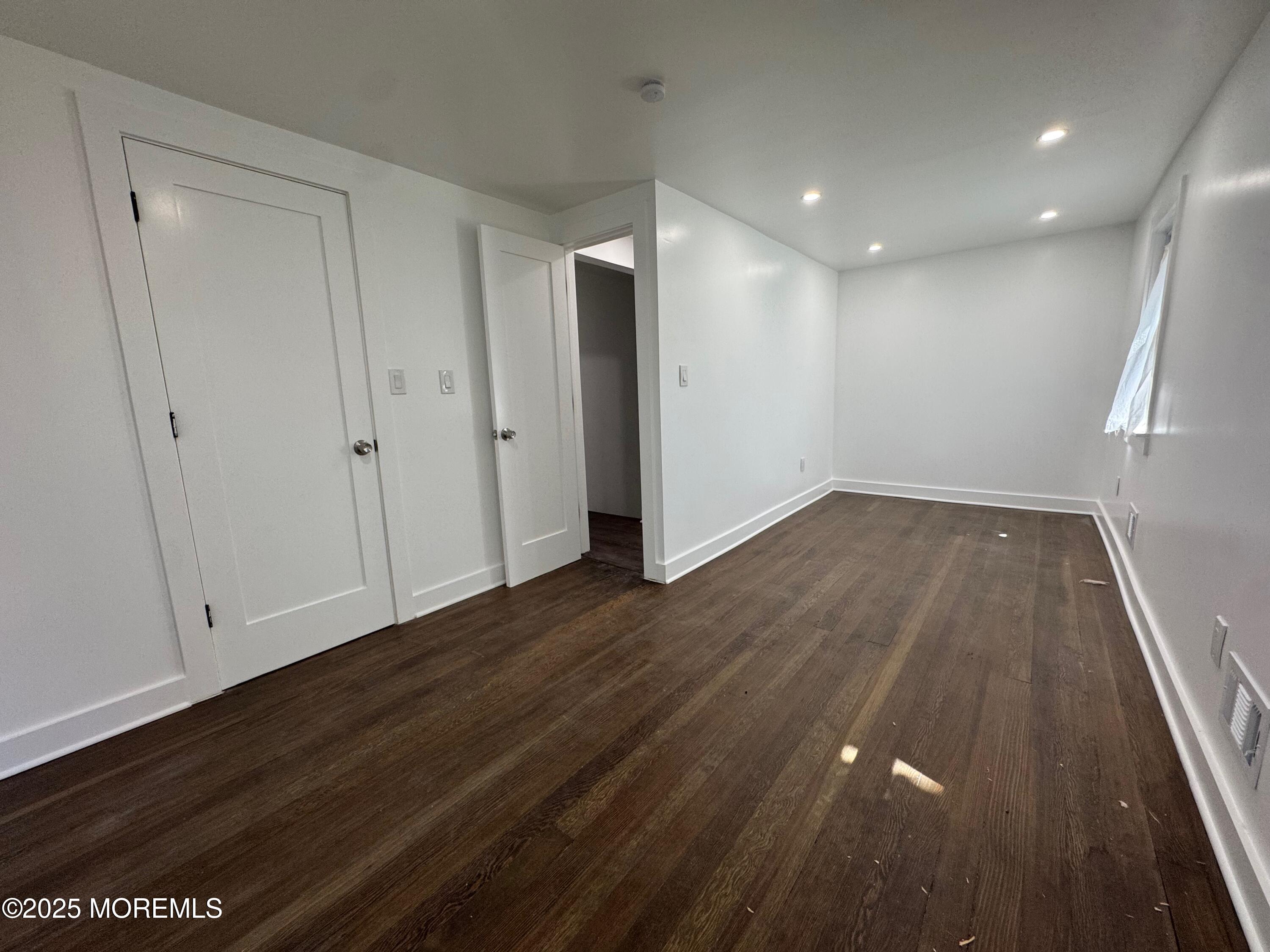 Undisclosed Address Tinton Falls, NJ 07724 - Photo 2 of 8 a view of hallway with wooden floor