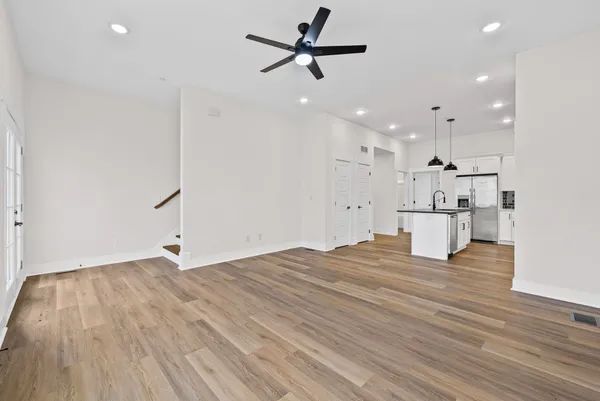 a view of kitchen with wooden floor and window